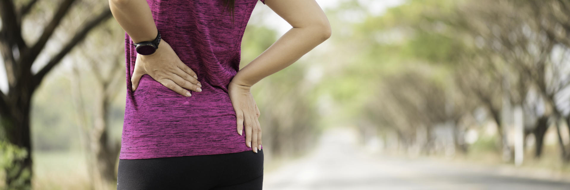 A runner woman with pain in lower back and hip area.