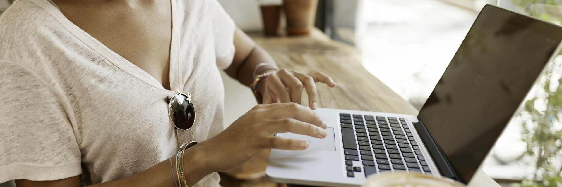 A woman using a laptop.