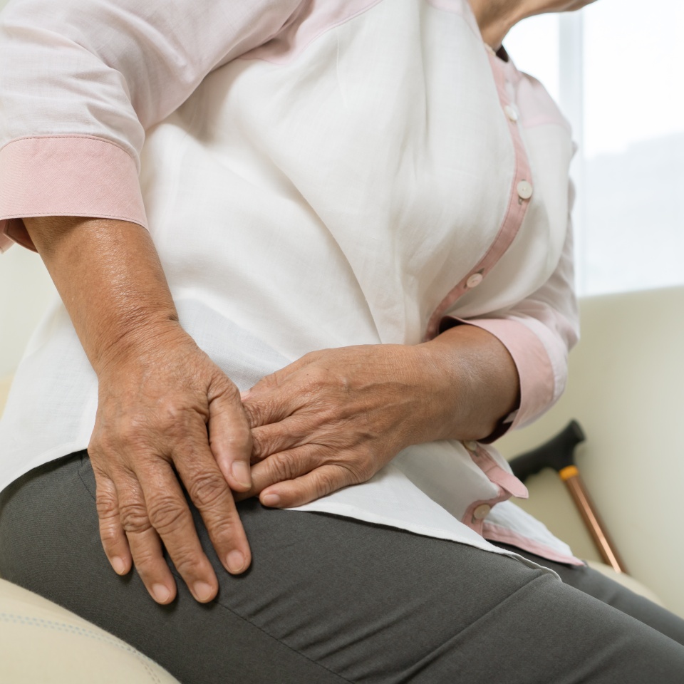 Hip pain of senior woman at home, healthcare problem of senior concept