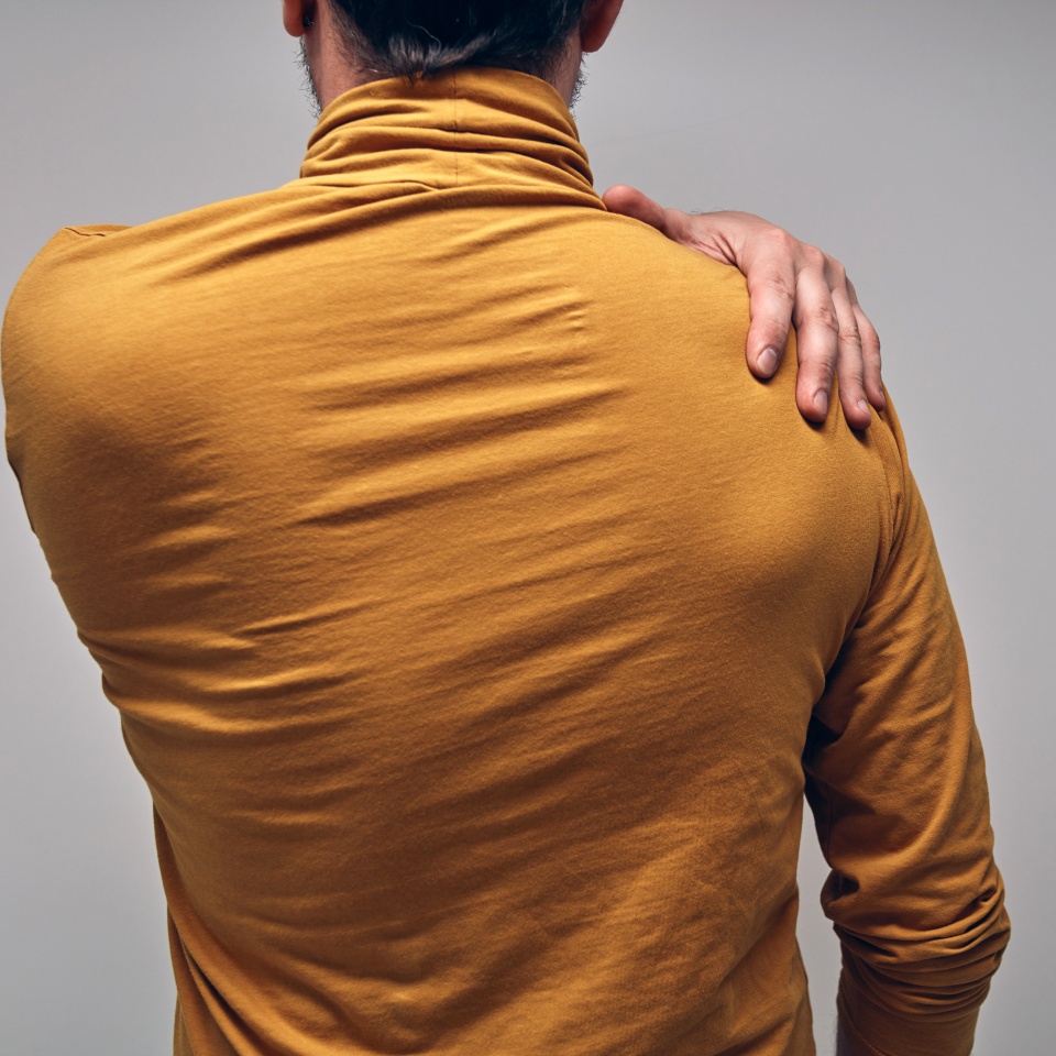 Adult caucasian man with shoulder pain.