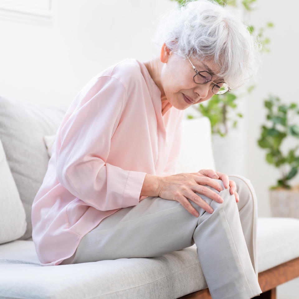 Senior woman suffering from knee pain