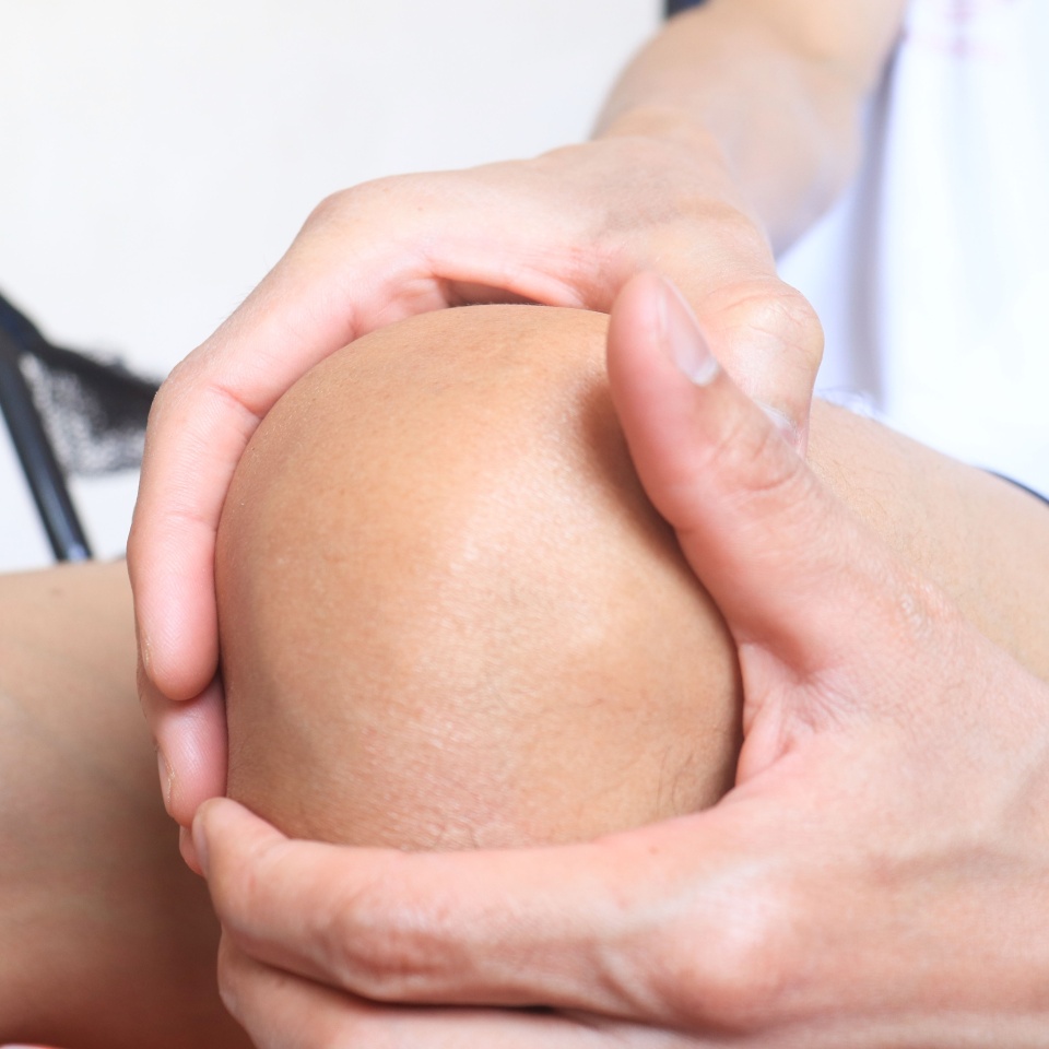 A little boy has a sore lega and knee